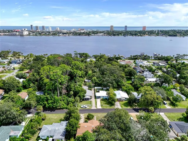 a view of a lake with houses in the back