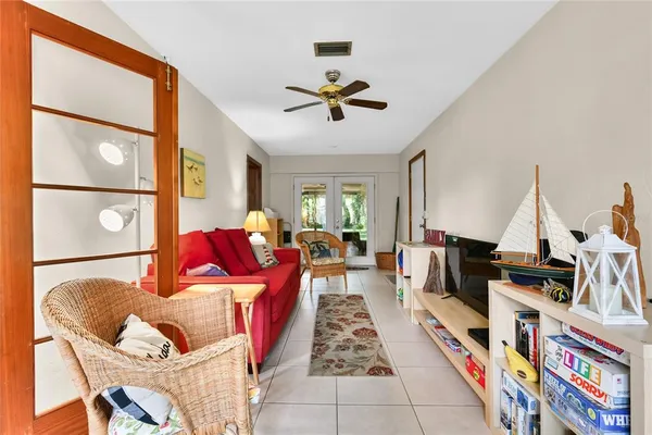 a living room with lots of furniture and a flat screen tv