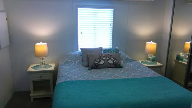 a living room with furniture and a lamp