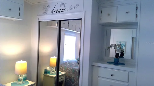 a en suite bathroom with a sink and a mirror