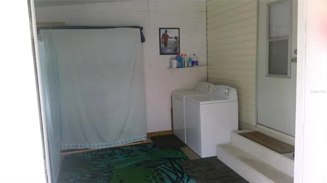a utility room with a window dryer and washer