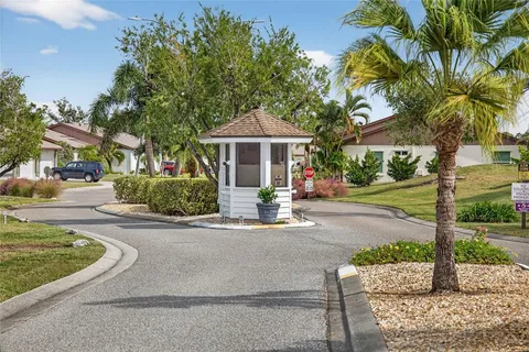a front view of a house with garden and porch