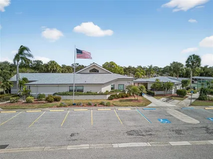 a view of a house with outdoor space and sitting area