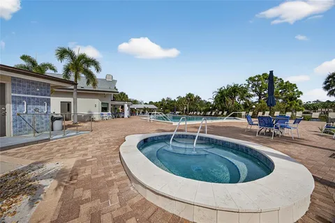 a view of a swimming pool with a patio