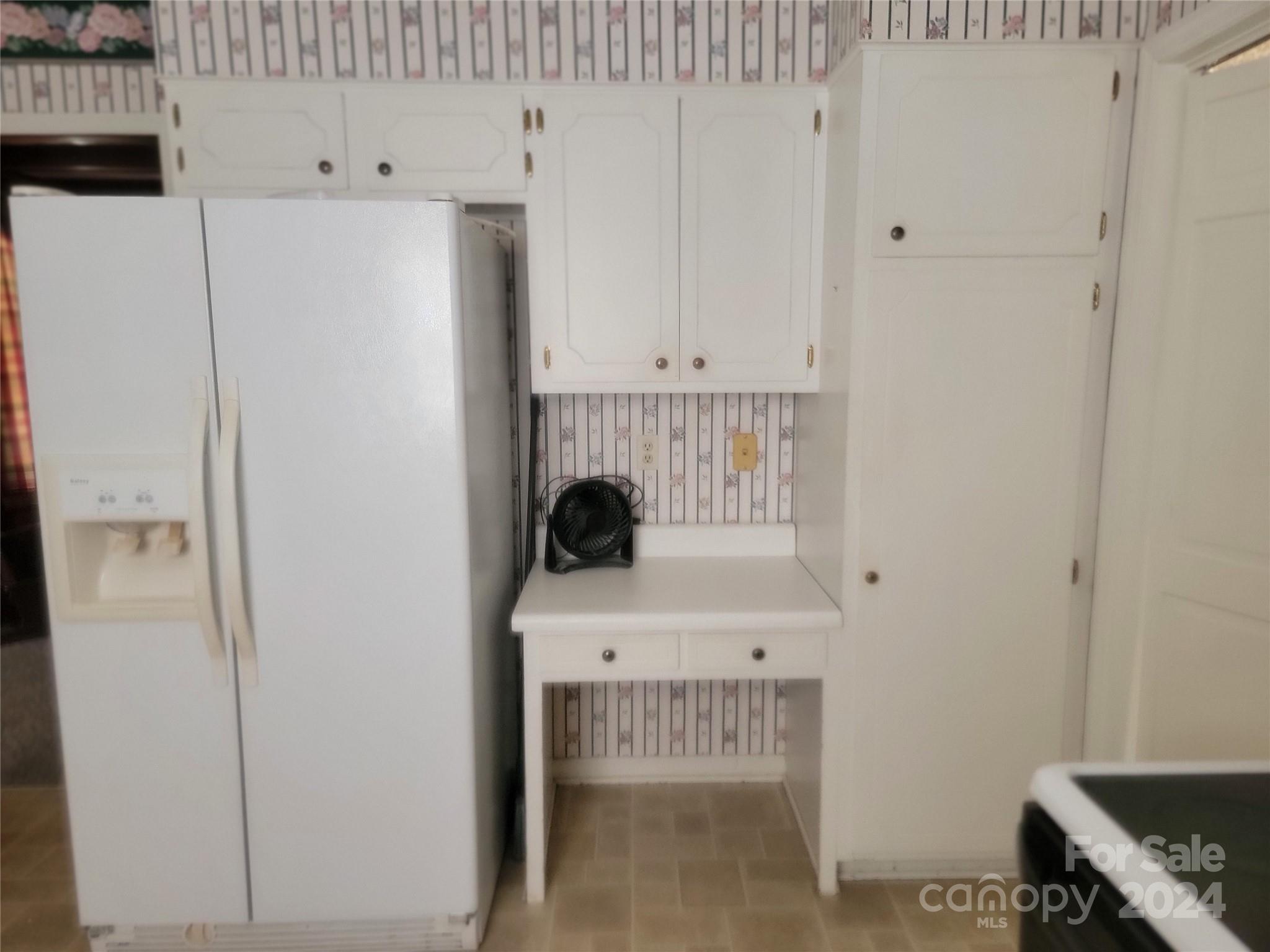 115 Hidden Hill Road Union, SC 29379 - Photo 19 of 35 a white refrigerator freezer and a stove sitting inside of a kitchen