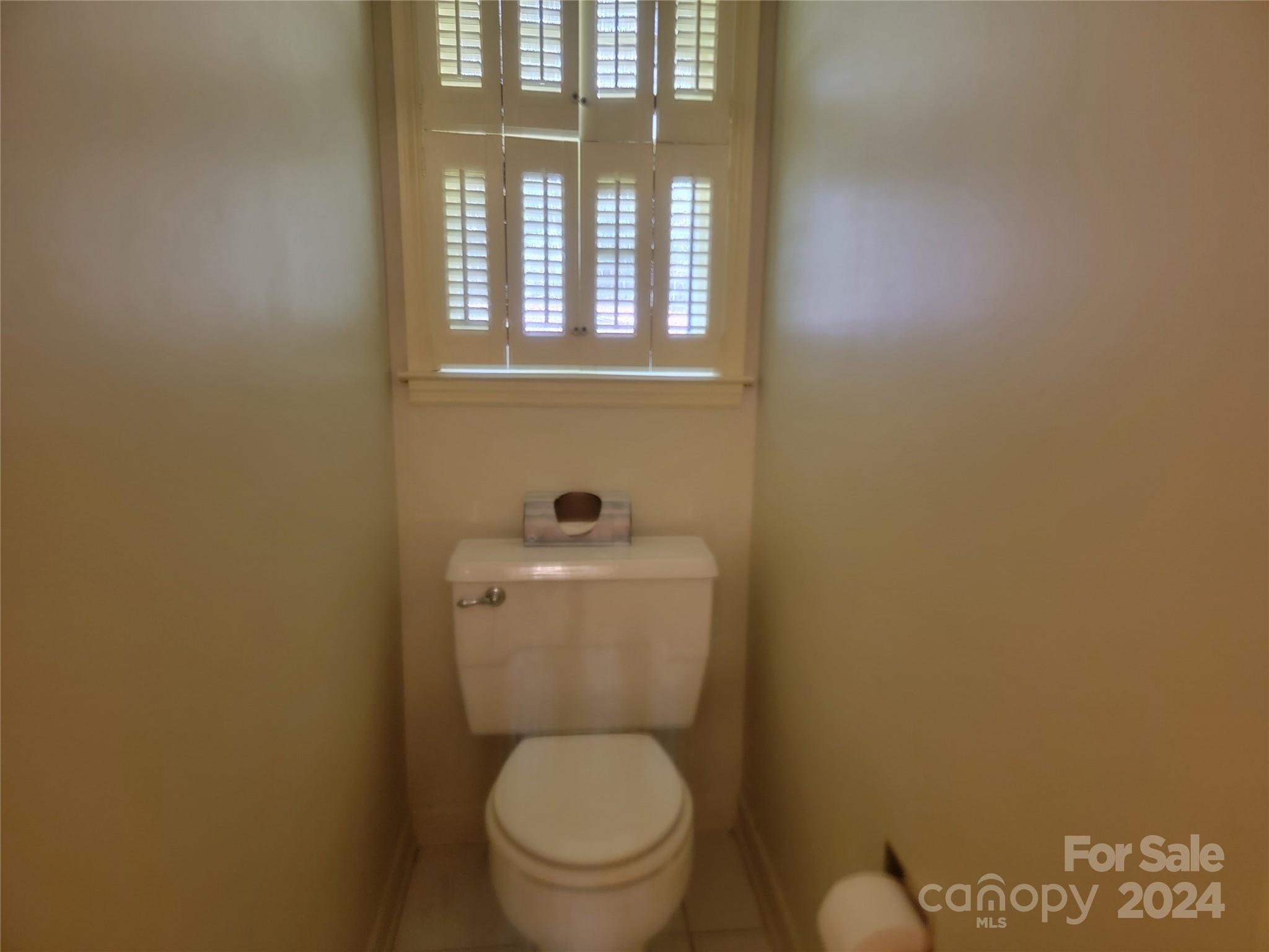 115 Hidden Hill Road Union, SC 29379 - Photo 31 of 35 a white toilet sitting next to a bathroom sink