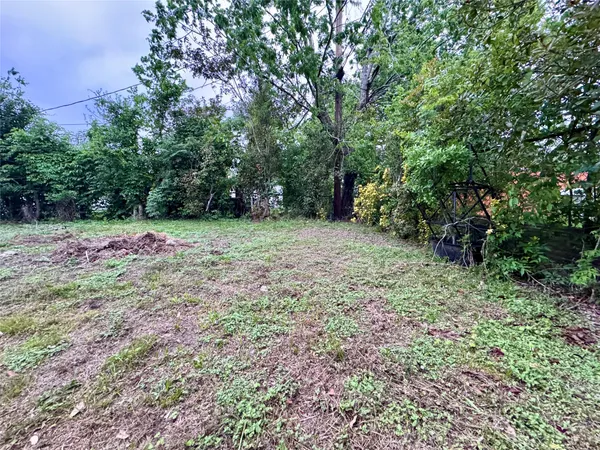 a fire hydrant in the middle of a field