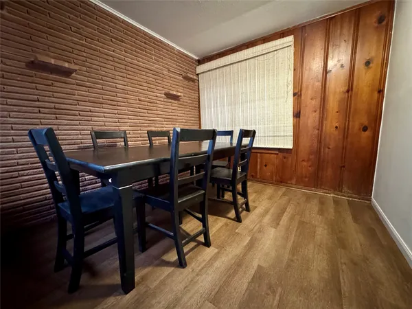 a view of a dining room with furniture and window