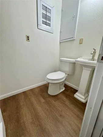 a bathroom with a toilet and a sink