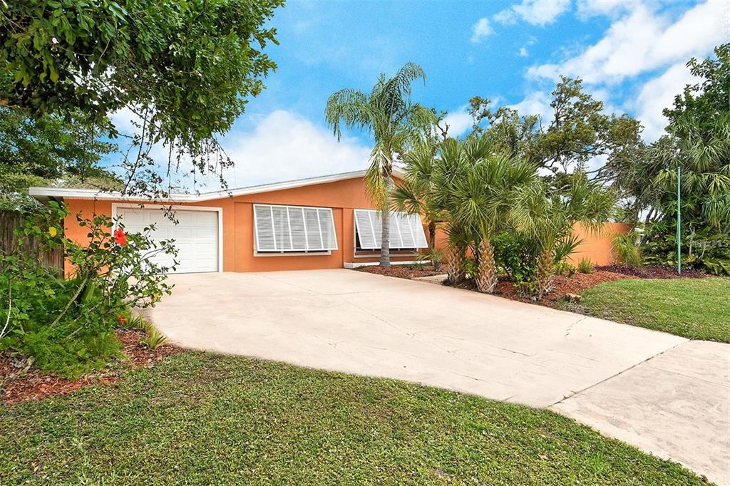 449 Redwood Road Venice, FL 34293 - Photo 2 of 40 a house view with a garden space