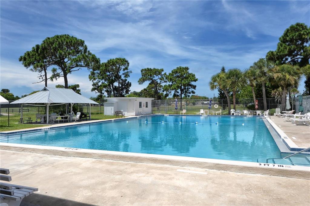 449 Redwood Road Venice, FL 34293 - Photo 27 of 40 a view of a swimming pool with a yard