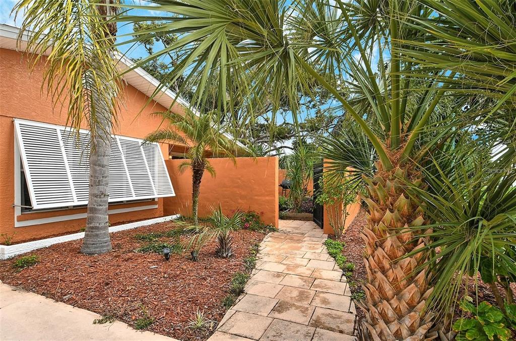 449 Redwood Road Venice, FL 34293 - Photo 3 of 40 a backyard of a house with seating space