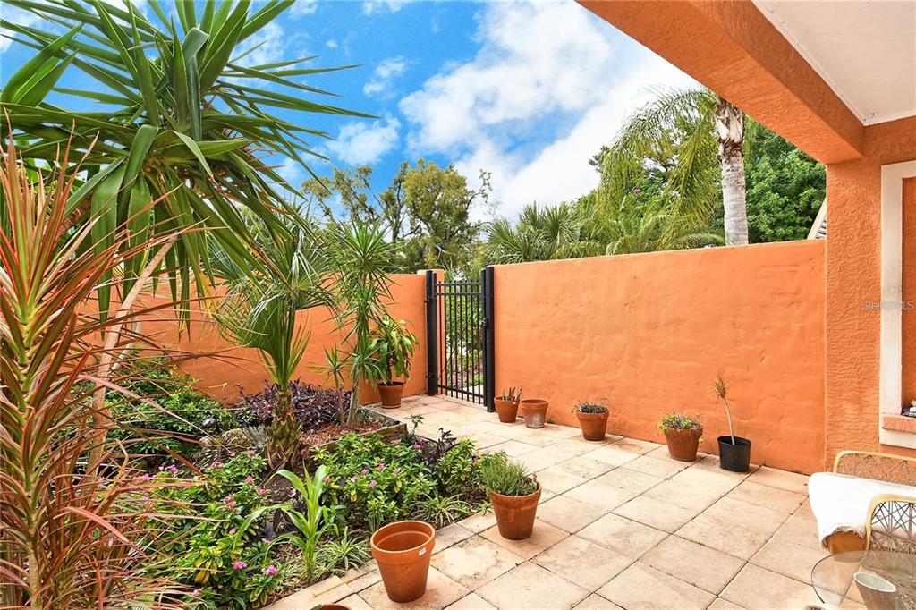 449 Redwood Road Venice, FL 34293 - Photo 4 of 40 a view of a balcony with plants and wooden fence