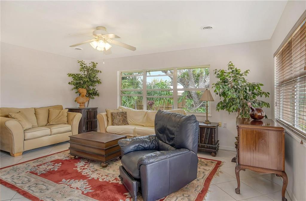 449 Redwood Road Venice, FL 34293 - Photo 7 of 40 a living room with furniture and a large window