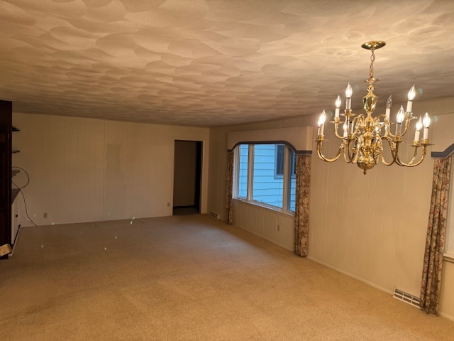 3307 North View Road Rockford, IL 61107 - Photo 11 of 19 a view of a livingroom with a chandelier