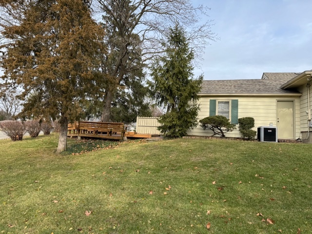 3307 North View Road Rockford, IL 61107 - Photo 4 of 19 a backyard of a house with table and chairs and potted plants
