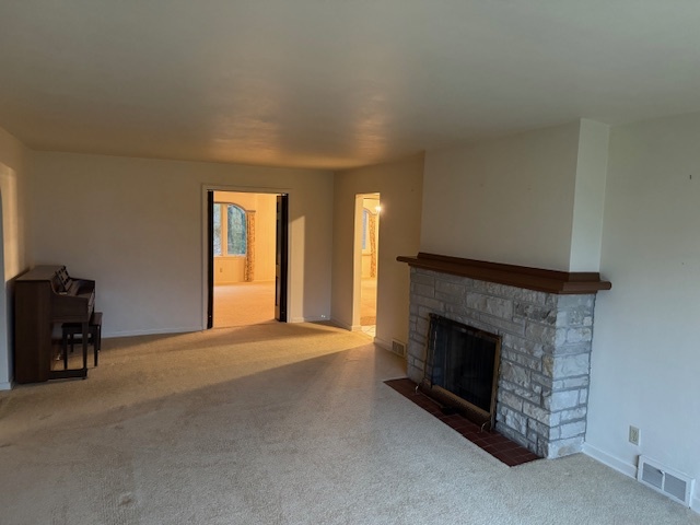 3307 North View Road Rockford, IL 61107 - Photo 10 of 19 a view of empty room with a fireplace and a window