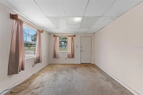 a view of a livingroom with hardwood floor and a ceiling fan