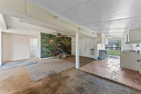 a kitchen with stainless steel appliances a refrigerator sink and cabinets