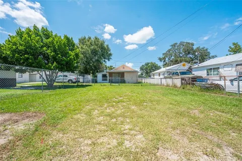 a view of a house with a yard porch and sitting area