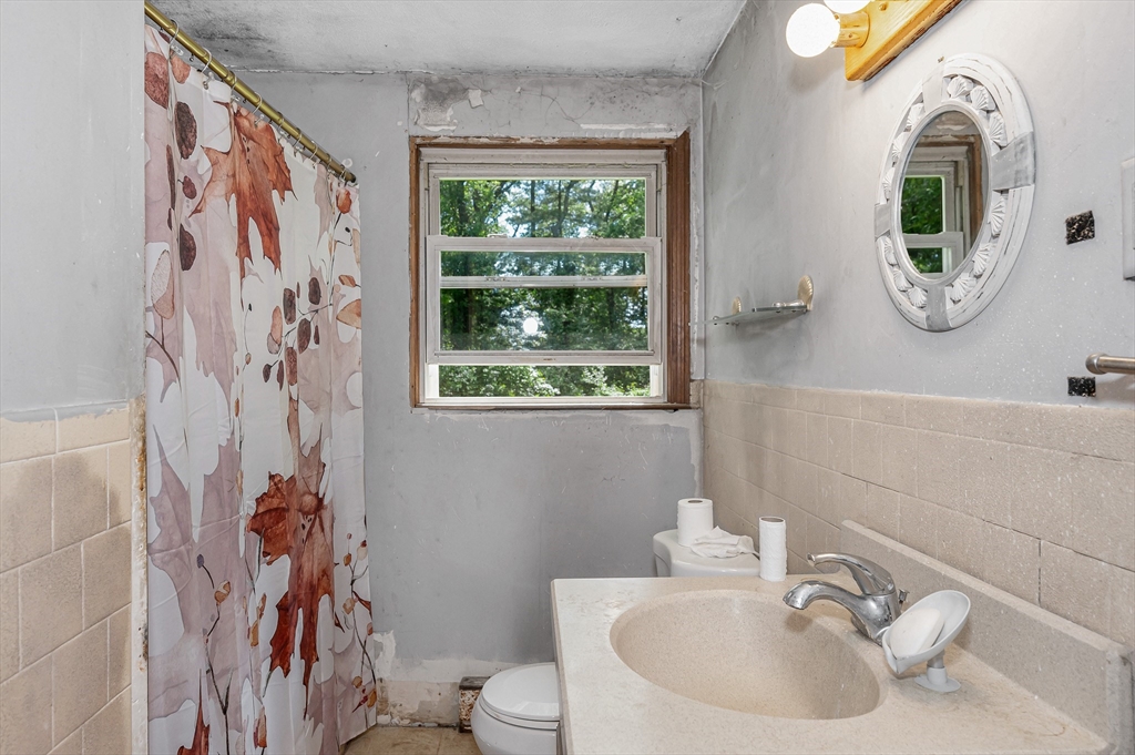19 Porter Street Billerica, MA 01821 - Photo 16 of 23 a bathroom with a sink and a mirror