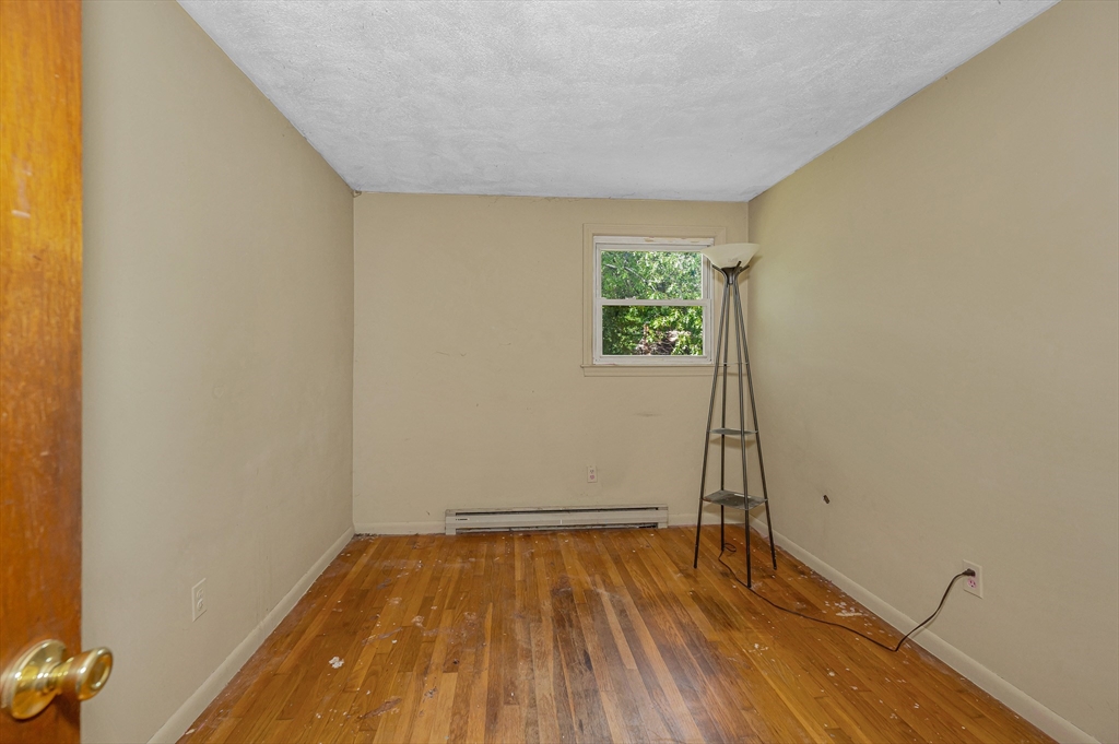 19 Porter Street Billerica, MA 01821 - Photo 19 of 23 a view of a room with wooden floor and a window