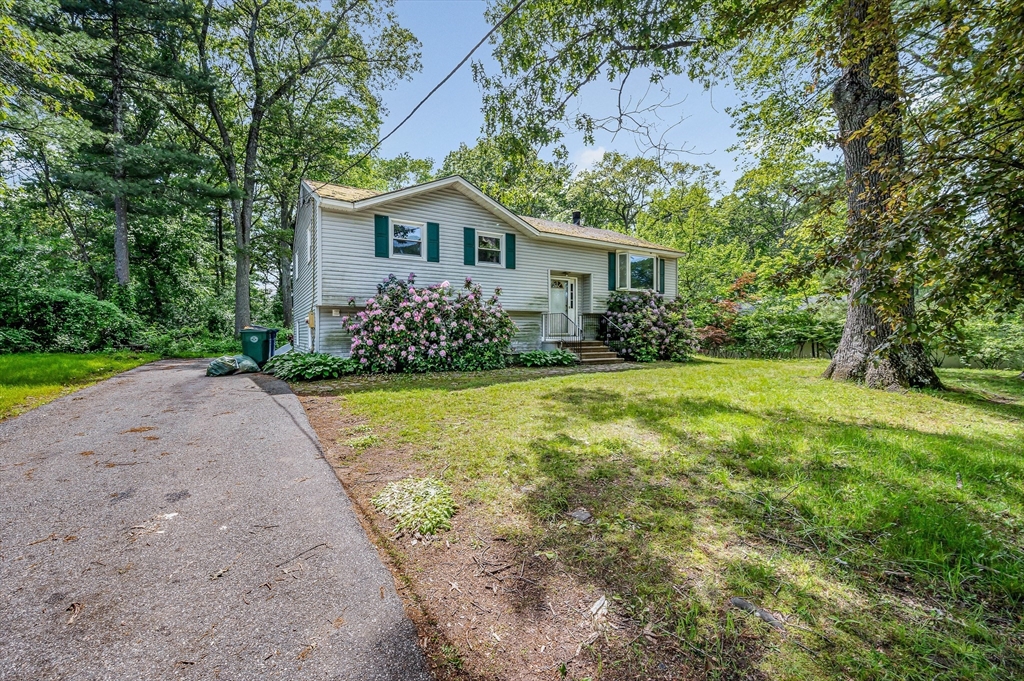 19 Porter Street Billerica, MA 01821 - Photo 2 of 23 a front view of house with yard and green space