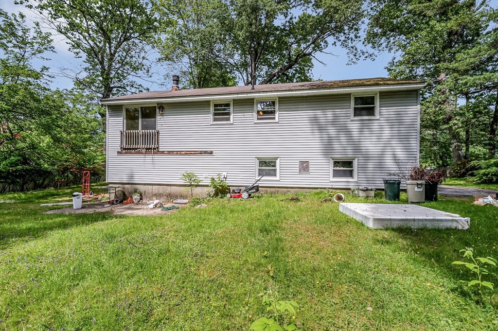 19 Porter Street Billerica, MA 01821 - Photo 5 of 23 a view of a house with a yard and chairs