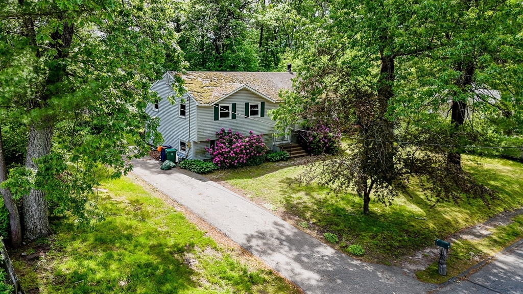 19 Porter Street Billerica, MA 01821 - Photo 6 of 23 a front view of a house with a yard
