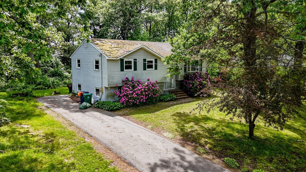 19 Porter Street Billerica, MA 01821 - Photo 7 of 23 a view of house with a yard and garden