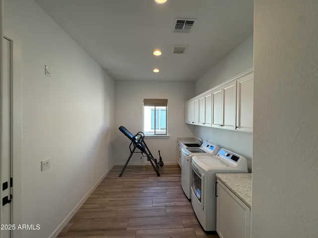 a storage room with washer and dryer
