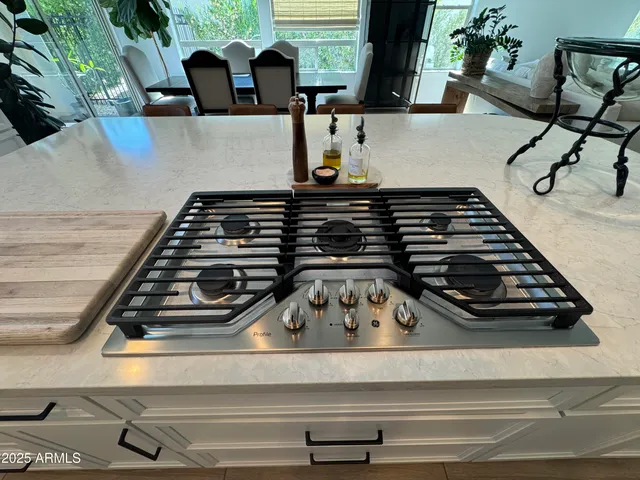 a close view of a stove a microwave and cabinets