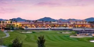 a view of a garden with a house