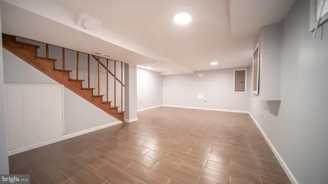 a view of an entryway with wooden floor