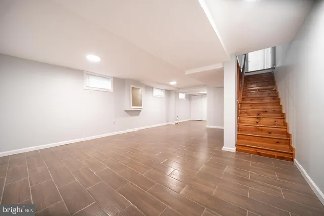 an empty room with wooden floor