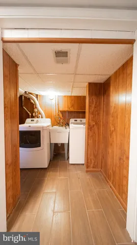 a utility room with washer and dryer