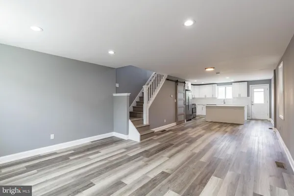 a view of a livingroom with wooden floor