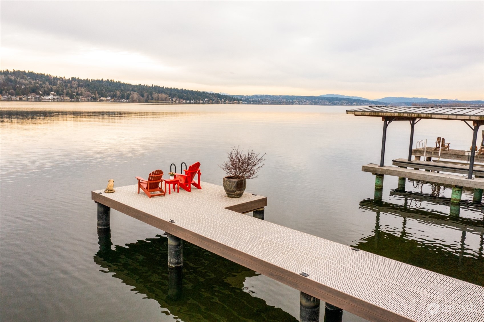 11730 Riviera Place Northeast Seattle, WA 98125 - Photo 30 of 34 a view of a lake with a table and chairs