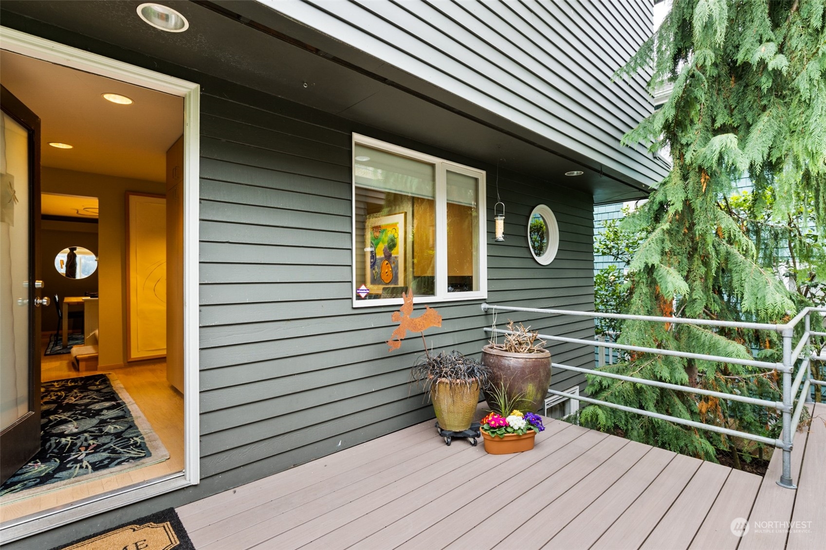 11730 Riviera Place Northeast Seattle, WA 98125 - Photo 3 of 34 a view of deck with wooden floor and seating space