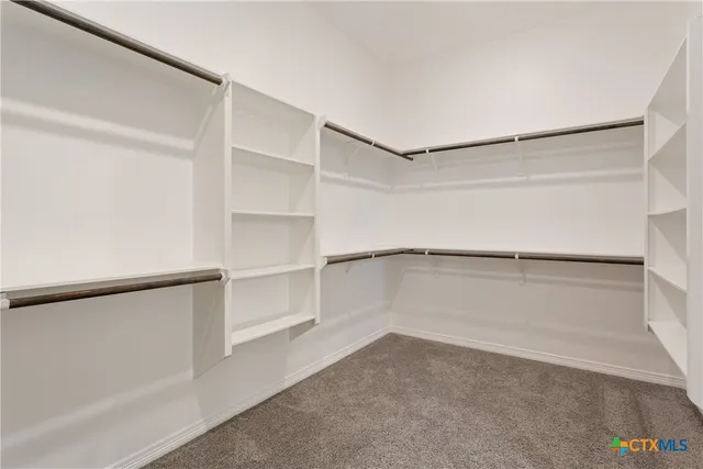 a view of an empty walk in closet