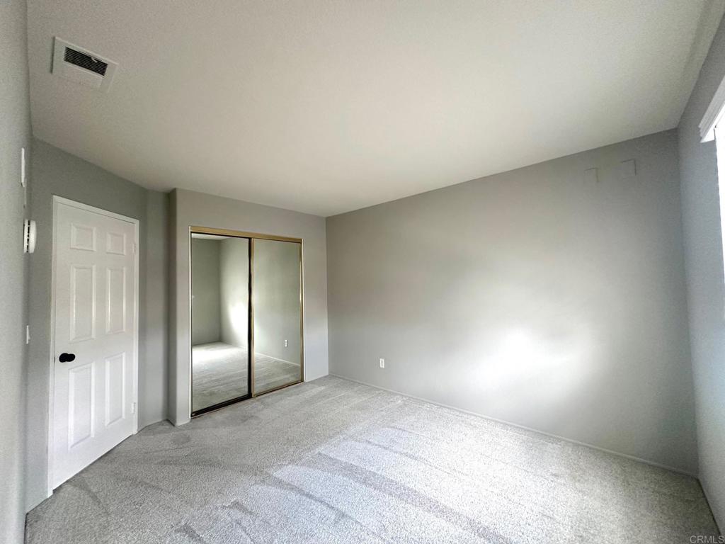 652 Montage Road Oceanside, CA 92057 - Photo 13 of 15 an empty room with windows and refrigerator