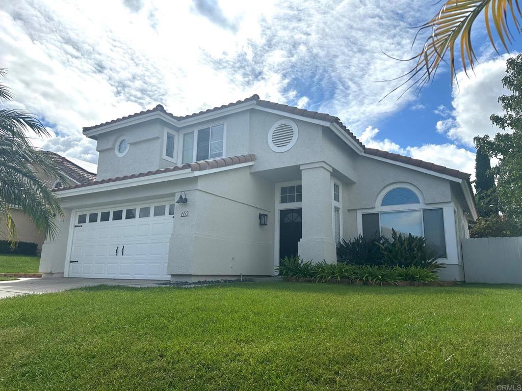 652 Montage Road Oceanside, CA 92057 - Photo 2 of 15 a view of a house with backyard and garden