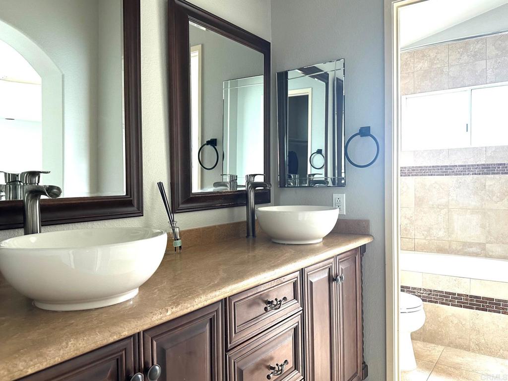 652 Montage Road Oceanside, CA 92057 - Photo 8 of 15 a view of living room with two sinks and a window