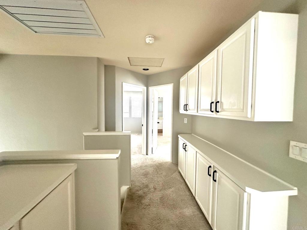 652 Montage Road Oceanside, CA 92057 - Photo 10 of 15 a bathroom with a sink a mirror and a bathtub