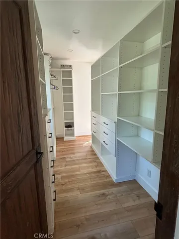 a view of closet area with empty racks