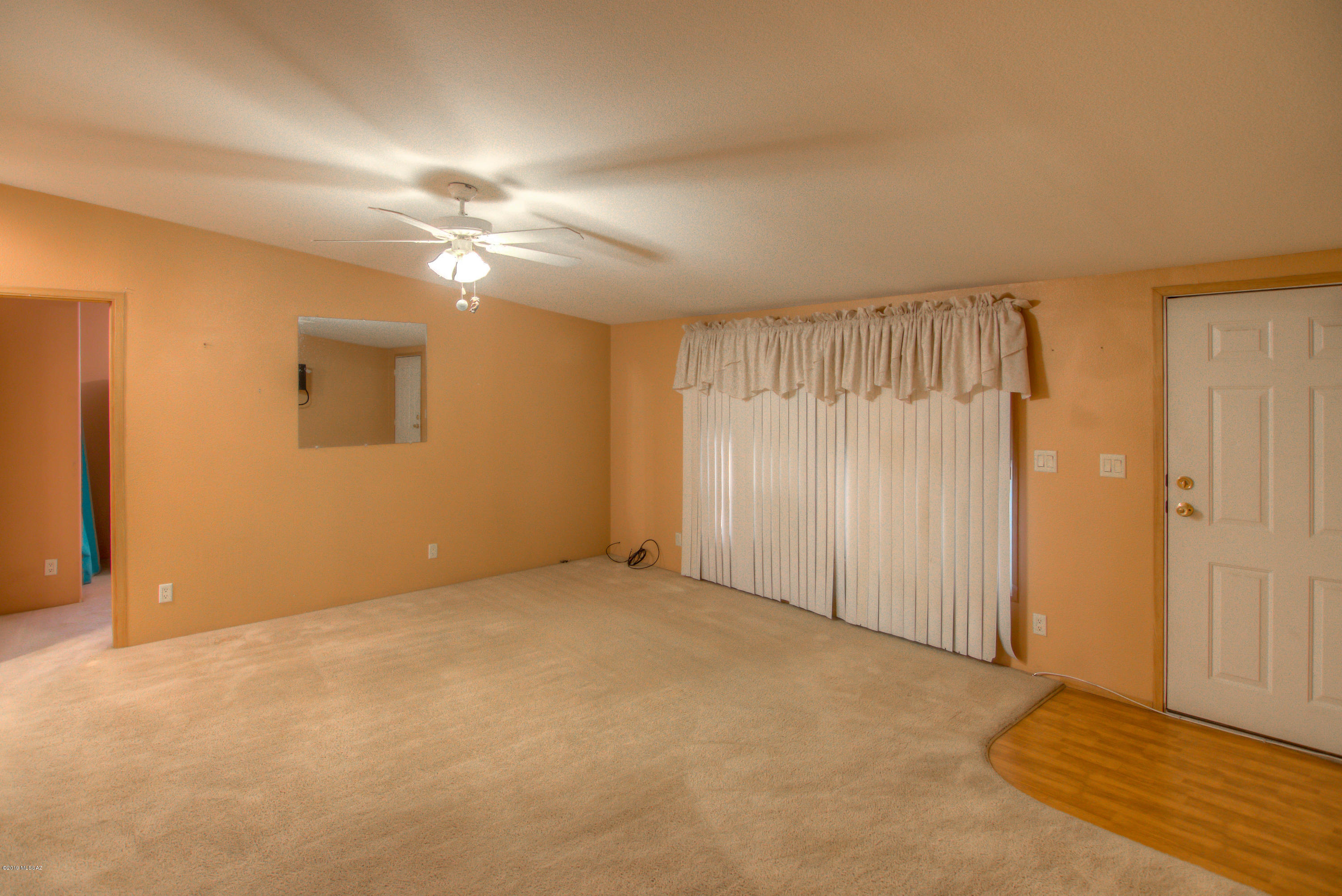 263 East Roger Road Tucson, AZ 85705 - Photo 11 of 31 an empty room with closet and a ceiling fan