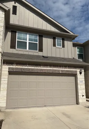 a view of a house with a garage