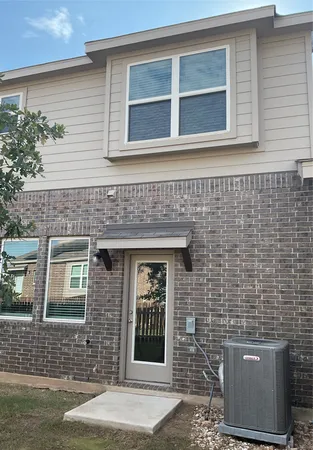 front view of a brick house with a window