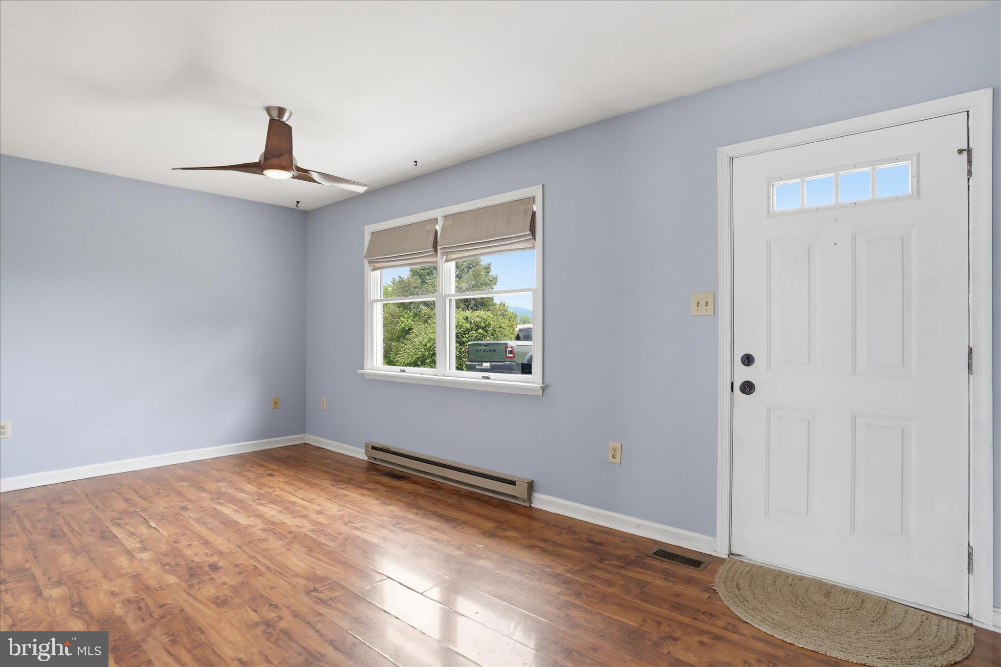 13733 Barnhart Road Clear Spring, MD 21722 - Photo 4 of 32 a view of an empty room with wooden floor and a window