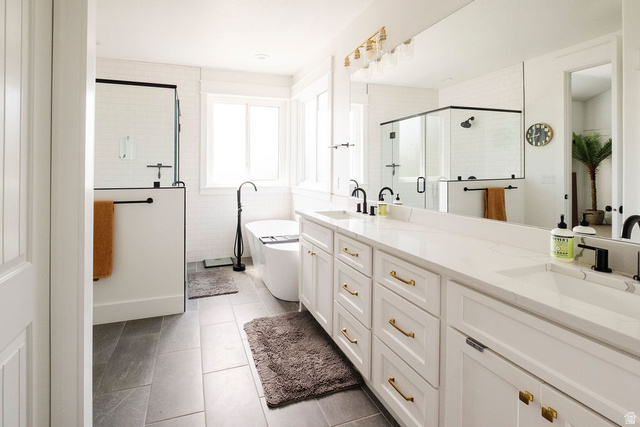 924 Country Lane Farmington, UT 84025 - Photo 27 of 91 Dual vanity with white cabinetry, gold-finish hardware, and a light-toned countertop